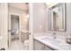 Bathroom features a modern vanity with double sinks, a large mirror, and neutral finishes at 5419 Sunningdale Dr, Charlotte, NC 28277