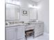 Bathroom featuring a dual vanity with granite countertops, modern lighting, and mirrors at 5419 Sunningdale Dr, Charlotte, NC 28277