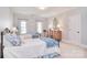 Bedroom with two twin beds with blue accents and neutral walls giving a welcoming vibe at 5419 Sunningdale Dr, Charlotte, NC 28277