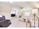 Spacious bonus room with a comfortable sectional, TV, and ample natural light at 5419 Sunningdale Dr, Charlotte, NC 28277
