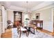 Elegant dining room featuring a chandelier, hardwood floors, and classic furniture at 5419 Sunningdale Dr, Charlotte, NC 28277