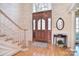 Elegant entryway showcasing a stunning front door with glass panes and light hardwood floors at 5419 Sunningdale Dr, Charlotte, NC 28277