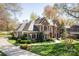 Beautiful brick home featuring manicured landscaping, black shutters, and a welcoming front entrance at 5419 Sunningdale Dr, Charlotte, NC 28277