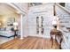 Grand foyer with a staircase, decorative wallpaper, and white trim at 5419 Sunningdale Dr, Charlotte, NC 28277