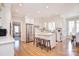 Bright, modern kitchen with stainless steel appliances, a center island, and white cabinets at 5419 Sunningdale Dr, Charlotte, NC 28277