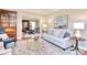 Cozy living room with a modern sofa, stylish decor, and hardwood flooring at 5419 Sunningdale Dr, Charlotte, NC 28277