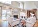 Bright living room featuring two sofas, a fireplace, and access to the outdoor space at 5419 Sunningdale Dr, Charlotte, NC 28277