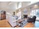 Spacious living room with a fireplace, large windows, and neutral tones at 5419 Sunningdale Dr, Charlotte, NC 28277