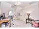 Home office with sloped ceilings, a desk, and cozy seating area at 5419 Sunningdale Dr, Charlotte, NC 28277