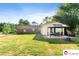 Home exterior featuring a spacious backyard with a gazebo and lush lawn, perfect for outdoor activities at 552 Odell School Rd, Concord, NC 28027