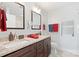 Bathroom features a double vanity with granite countertops, two framed mirrors, and modern lighting fixtures at 552 Odell School Rd, Concord, NC 28027