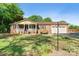 Charming brick home featuring a welcoming front porch, manicured lawn, and a two-car garage at 552 Odell School Rd, Concord, NC 28027