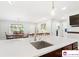 Kitchen island with white countertops, sink, and views to the dining area and entry at 552 Odell School Rd, Concord, NC 28027