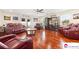 Bright living room offering hardwood floors, comfortable leather sofas, and stylish decor at 552 Odell School Rd, Concord, NC 28027