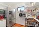 Well-organized pantry features a stainless steel refrigerator and adjustable shelving for ample storage at 552 Odell School Rd, Concord, NC 28027
