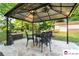 Outdoor patio area with a gazebo, perfect for relaxing and enjoying the outdoor setting at 552 Odell School Rd, Concord, NC 28027
