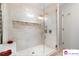 Luxurious walk-in shower with glass door and modern fixtures, perfect for a spa-like experience at 552 Odell School Rd, Concord, NC 28027