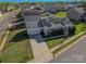 Charming two-story home featuring solar panels, a front porch, an attached garage, and a concrete driveway at 6308 Brumit Ln, Charlotte, NC 28269
