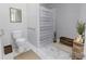 Well-lit bathroom featuring marble floors, shower with a curtain and modern fixtures at 6308 Brumit Ln, Charlotte, NC 28269