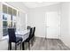 Bright dining room features a modern table set with large window for ample natural lighting at 6308 Brumit Ln, Charlotte, NC 28269