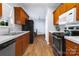 Traditional kitchen features wood cabinets, modern appliances, and laminate countertops at 6308 Brumit Ln, Charlotte, NC 28269