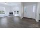 Spacious living room with a large window allowing natural light to illuminate the space at 6308 Brumit Ln, Charlotte, NC 28269