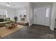 Inviting living room with hardwood floors, comfortable seating and a bright white front entrance at 6308 Brumit Ln, Charlotte, NC 28269