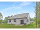 The backyard features an easy to maintain lawn with a small patio at 700 Sunset Pointe Dr, Salisbury, NC 28146