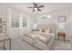 Bedroom with a large window, ceiling fan and neutral color palette at 700 Sunset Pointe Dr, Salisbury, NC 28146