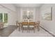 Bright dining room with modern decor, a large window and neutral color palette at 700 Sunset Pointe Dr, Salisbury, NC 28146