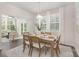 Light-filled dining area featuring modern chandelier and view into living room at 700 Sunset Pointe Dr, Salisbury, NC 28146