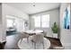 Bright dining area features modern lighting, a round table, and stylish seating, creating an inviting atmosphere at 700 Sunset Pointe Dr, Salisbury, NC 28146