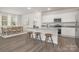 Kitchen with a granite island, counter seating, and stainless steel appliances at 700 Sunset Pointe Dr, Salisbury, NC 28146