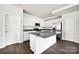 Spacious kitchen features white cabinets, stainless steel appliances, and large center island at 700 Sunset Pointe Dr, Salisbury, NC 28146