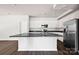 Modern kitchen boasts stainless steel appliances, granite counters, and an eat-in island at 700 Sunset Pointe Dr, Salisbury, NC 28146