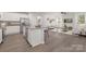 Open kitchen concept with granite counters and stainless steel appliances at 700 Sunset Pointe Dr, Salisbury, NC 28146