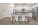 Kitchen with a granite island, counter seating, and stainless steel appliances at 700 Sunset Pointe Dr, Salisbury, NC 28146
