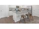 Bright kitchen features a granite island with bar seating and stainless steel appliances at 700 Sunset Pointe Dr, Salisbury, NC 28146