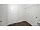 Bright laundry room features wood-look flooring, a washer/dryer hookup, and wire shelving at 700 Sunset Pointe Dr, Salisbury, NC 28146
