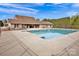 Community pool area with a fenced-in pool with a concrete patio at 700 Sunset Pointe Dr, Salisbury, NC 28146