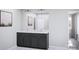 Bathroom featuring a double vanity with a white countertop and modern fixtures at 7027 Short Stirrup Ln, Mint Hill, NC 28227