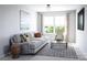 Cozy living room with comfortable seating, natural light, and a modern coffee table at 7027 Short Stirrup Ln, Mint Hill, NC 28227