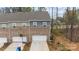 Townhome exterior with attached garage and view of the surrounding community at 7918 Nelson Rd, Mint Hill, NC 92227