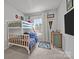 Bedroom featuring a bunk bed, a window with natural light and artwork at 7918 Nelson Rd, Mint Hill, NC 92227