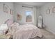 Bedroom with pink bed, decor, and natural light at 7918 Nelson Rd, Mint Hill, NC 92227