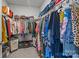Walk-in closet featuring an organized arrangement of clothes and shelves at 7918 Nelson Rd, Mint Hill, NC 92227