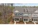 Exterior shot of the townhome with a covered porch and beautiful stone accents at 7918 Nelson Rd, Mint Hill, NC 92227