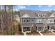 Exterior shot of the townhome with a covered porch and beautiful stone accents at 7918 Nelson Rd, Mint Hill, NC 92227