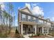 Stylish townhome featuring stone accents, blue siding, and a welcoming front porch at 7918 Nelson Rd, Mint Hill, NC 92227