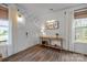 Inviting foyer featuring stylish decor, hardwood floors, and ample natural light at 7918 Nelson Rd, Mint Hill, NC 92227